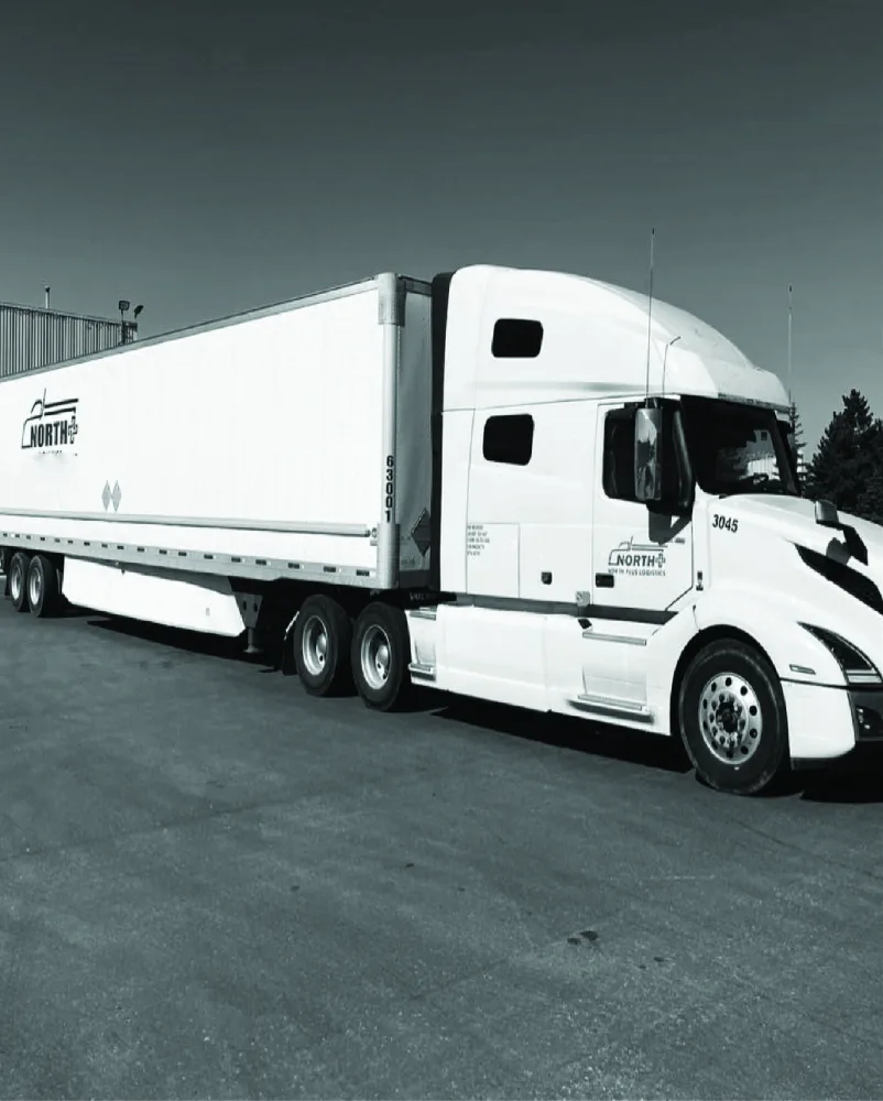 North Plus Nexus truck and trailer parked in a transport yard